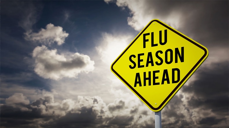 flu season ahead against dark sky with white clouds