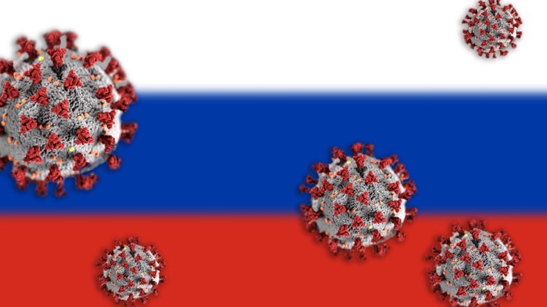 Concept of Coronavirus or Covid-19 particles overshadowing blurred flag of Russia in background