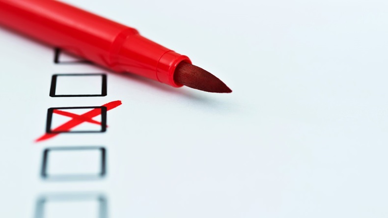 Red pen marks checkbox with a cross.