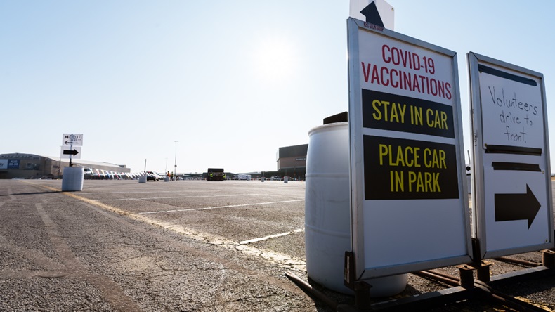 LOUISVILLE, KY - JANUARY 04: A sign with directions is posted for drivers entering the vaccination area during the first day of mass Moderna COVID-19 vaccinations in Broadbent Arena at the Kentucky State Fair and Exposition Center on January 4, 2021 in Louisville, Kentucky. Monday marked the first day of mass, drive-in vaccinations in the state. Healthcare workers are the main focus of vaccinations, as mandated by the federal government. (Photo by Jon Cherry/Getty Images)