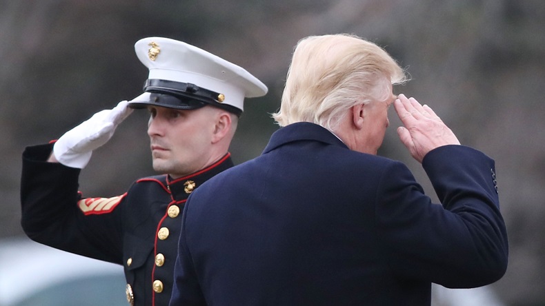 WASHINGTON, DC - MARCH 20: U.S. President Donald Trump salutes a U.S. Marine before boarding Marine One while departing from the White House, on March 20, 2017 in Washington, DC. President Trump is traveling to Louisville Kentucky to speak at a Make America Great Rally. (Photo by Mark Wilson/Getty Images)