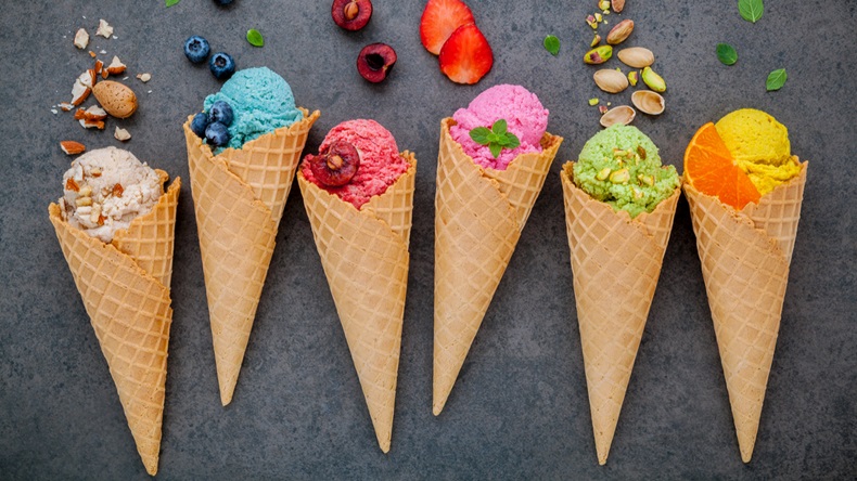 Various of ice cream flavor in cones blueberry ,strawberry ,pistachio ,almond ,orange and cherry setup on dark stone background . Summer and Sweet menu concept. - Image 