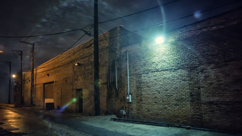 Dark and eerie industrial urban city street at night in Chicago - Image 