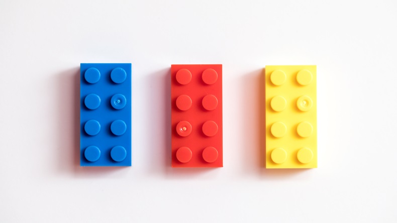 Childrens building blocks similar to legos, yellow red and blue - Image 
