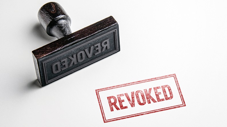 Rubber stamping that says 'Revoked'. - Image 