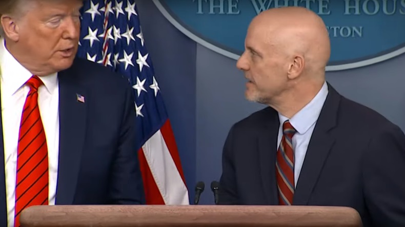 Hahn looks at Trump at White House briefing 19 March 2020.jpg