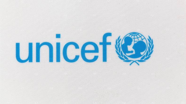 Unicef logo on a panel.