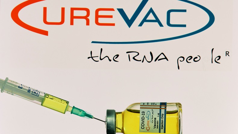MALLORCA/SPAIN- November 21 2020: CureVac research Coronavirus (Covid 19) vaccine. Row of vaccine bottles with blurred CureVac company logo on background.