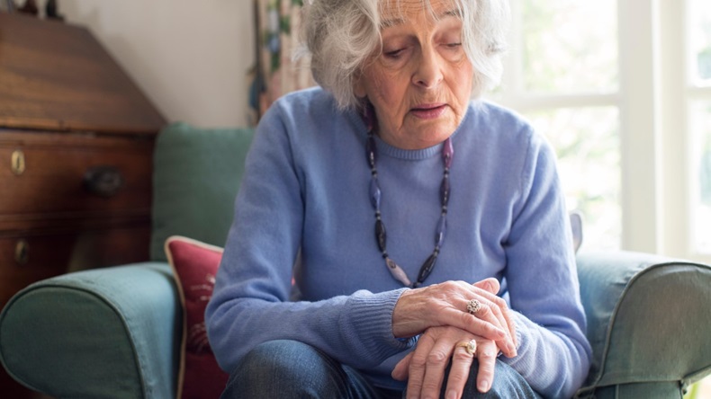 Senior Woman Suffering With Parkinsons Diesease