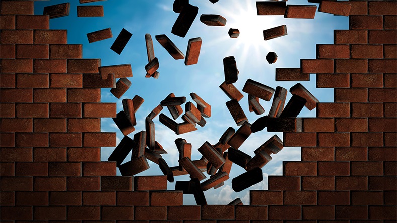 brick wall falling down (Alamy)