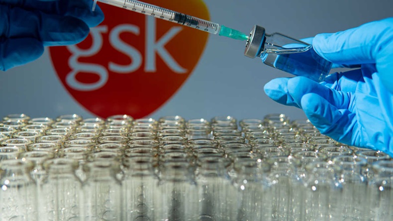 Vaccine vials with GSK logo in background 