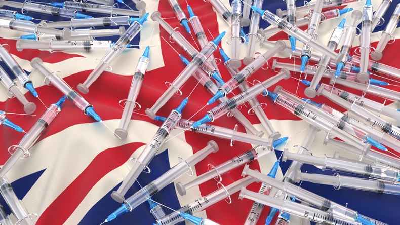 Coronavirus Vaccine and Syringe with needle on the UK (United Kingdom) Flag,