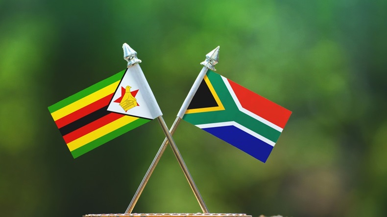 South Africa and Zimbabwe small flag with blur green background