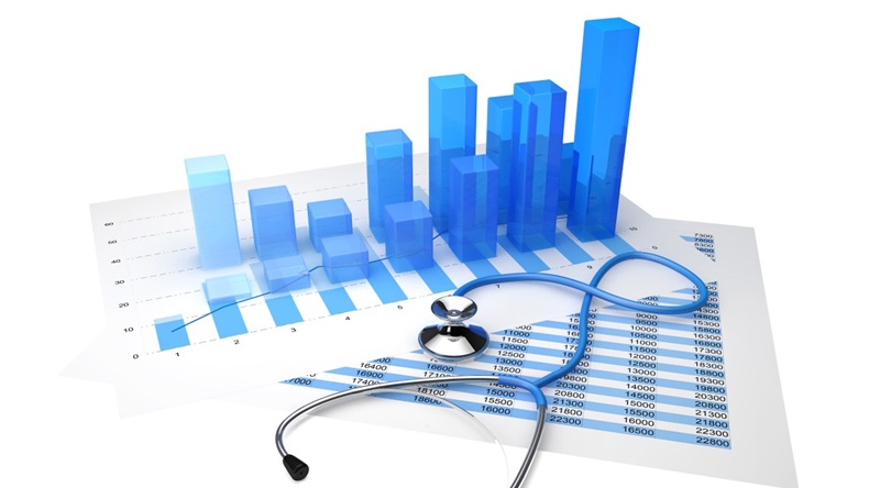 Stethoscope placed on top of the sheet with statistical graphs