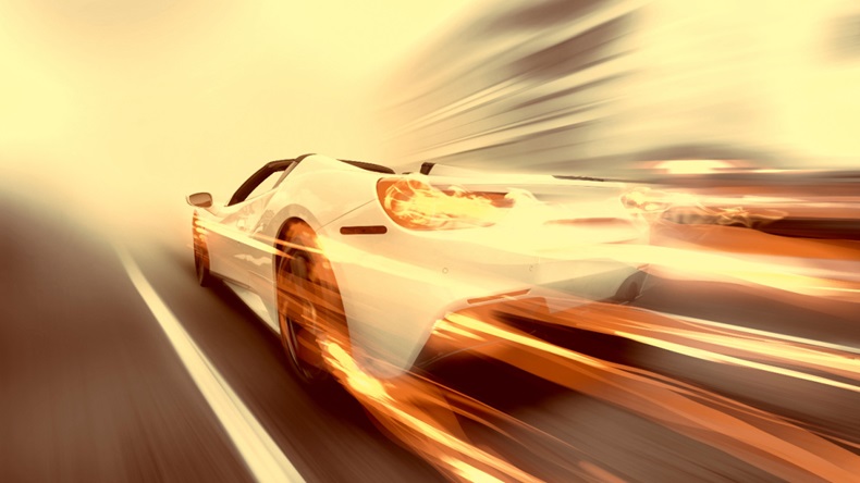 white sports car going at high speed