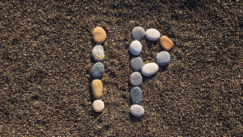 IP Intellectual Property or Internet protocol text made from stones on sea beach