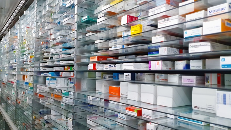 A pharmacy storage room. Drugs are arranged and stored on a glass shelf in a pharmacy