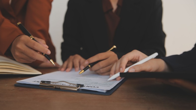 businessman brainstorming information on agreement details