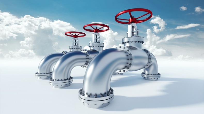 Industrial metal pipeline with valve on blue sky background