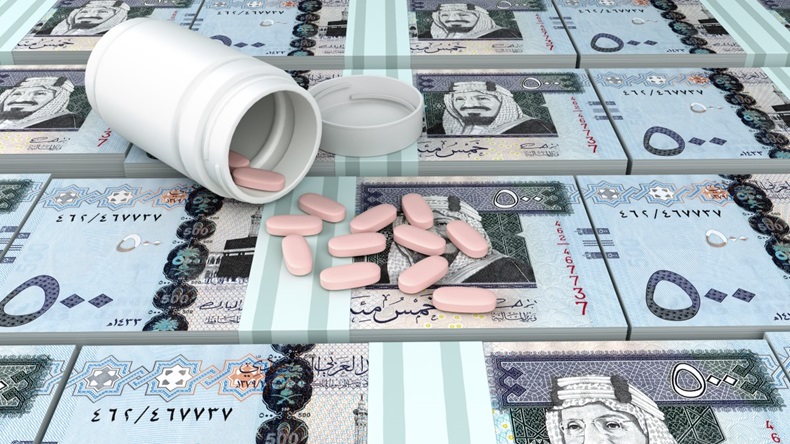 Close up of 3D medicine, tablets pills on top of Kingdom of Saudi Arabia money