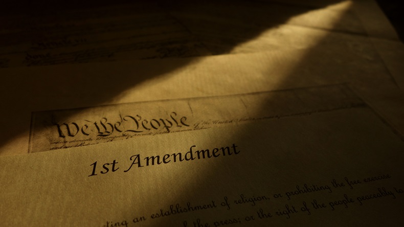 First Amendment parchment and We The People text from the US Constitution
